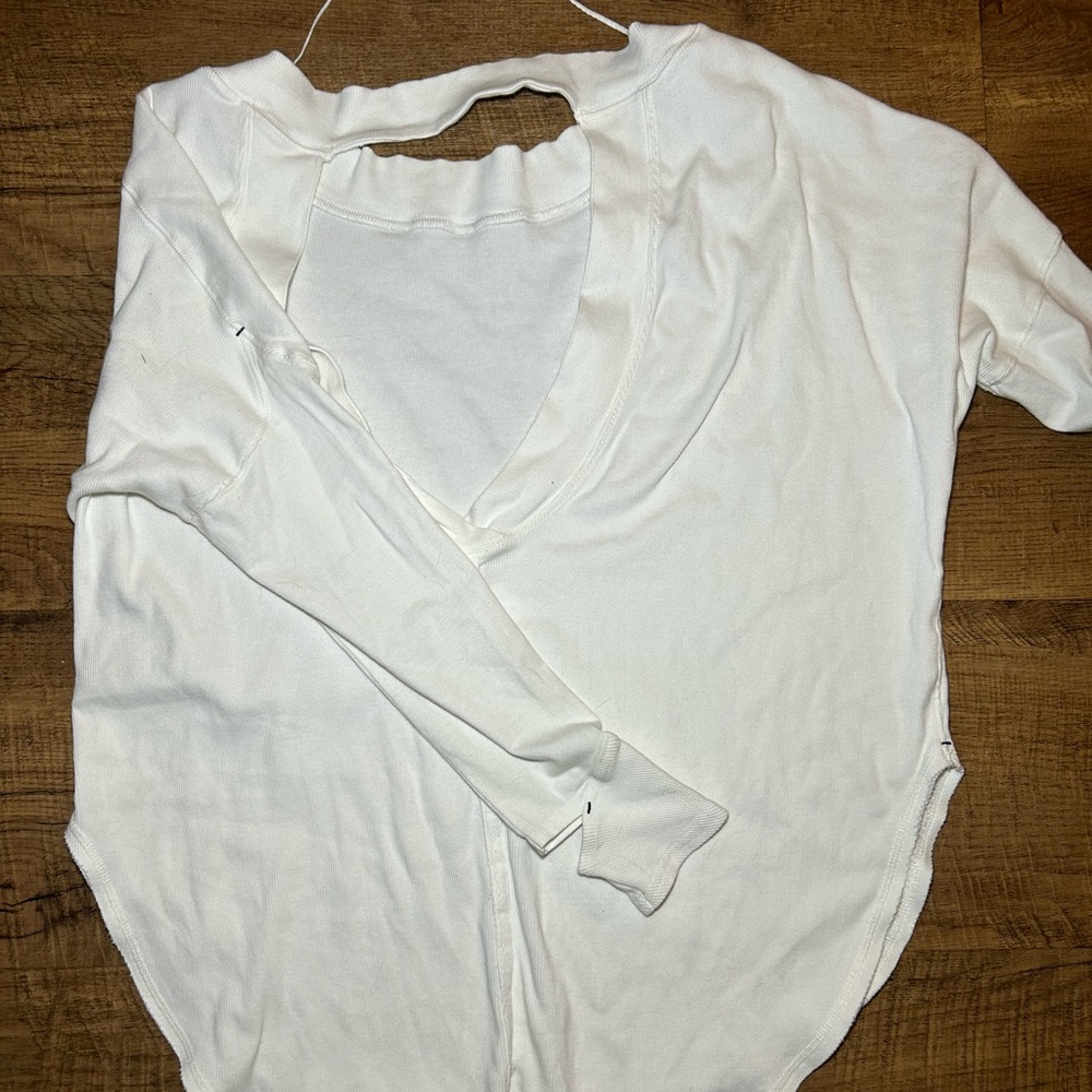 Free People Top, both sleeves have thumb holes, back is open